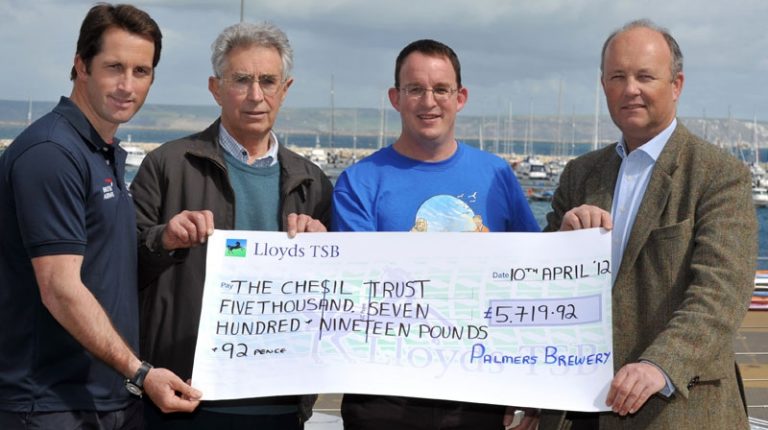 Sailing legend Ben Ainslie receives Palmers’ donation to Chesil Trust