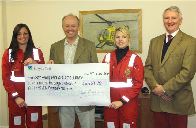 Cleeves Palmer presenting a cheque to the Dorset and Somerset Air Ambulance