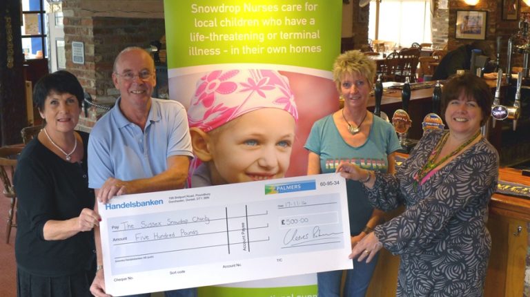 The Sussex Snowdrop Trust receives a cheque for £500 from the Palmers Ale Fund