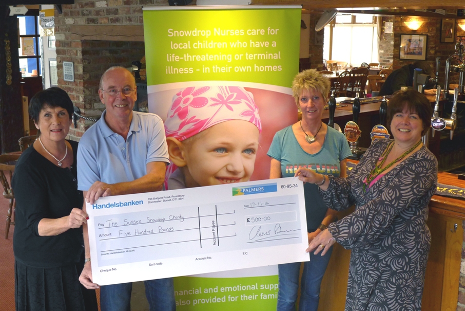 The Sussex Snowdrop Trust receives a cheque for £500 from the Palmers Ale Fund