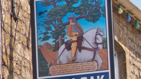 Swing sign outside the Royal Oak in Drimpton.