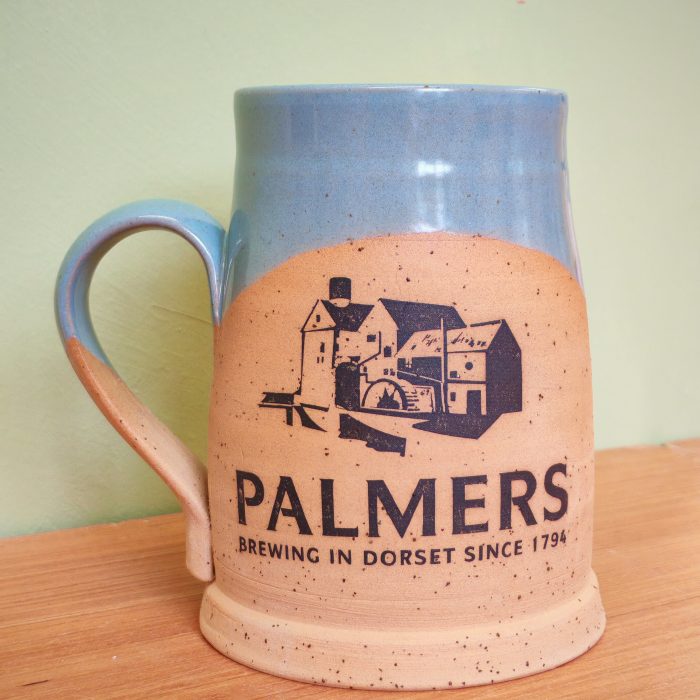 Handmade tankard with Palmers logo in blue and stone colouring